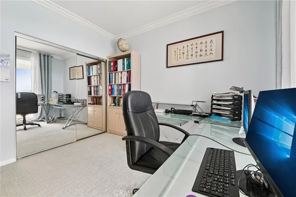 a view of a workspace with furniture and a couch