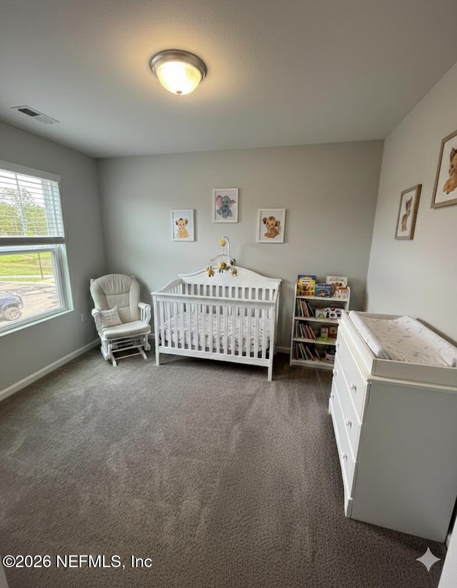8614 Crystalline Lane Jacksonville, FL 32221 - Photo 11 of 20 a living room with furniture and a window