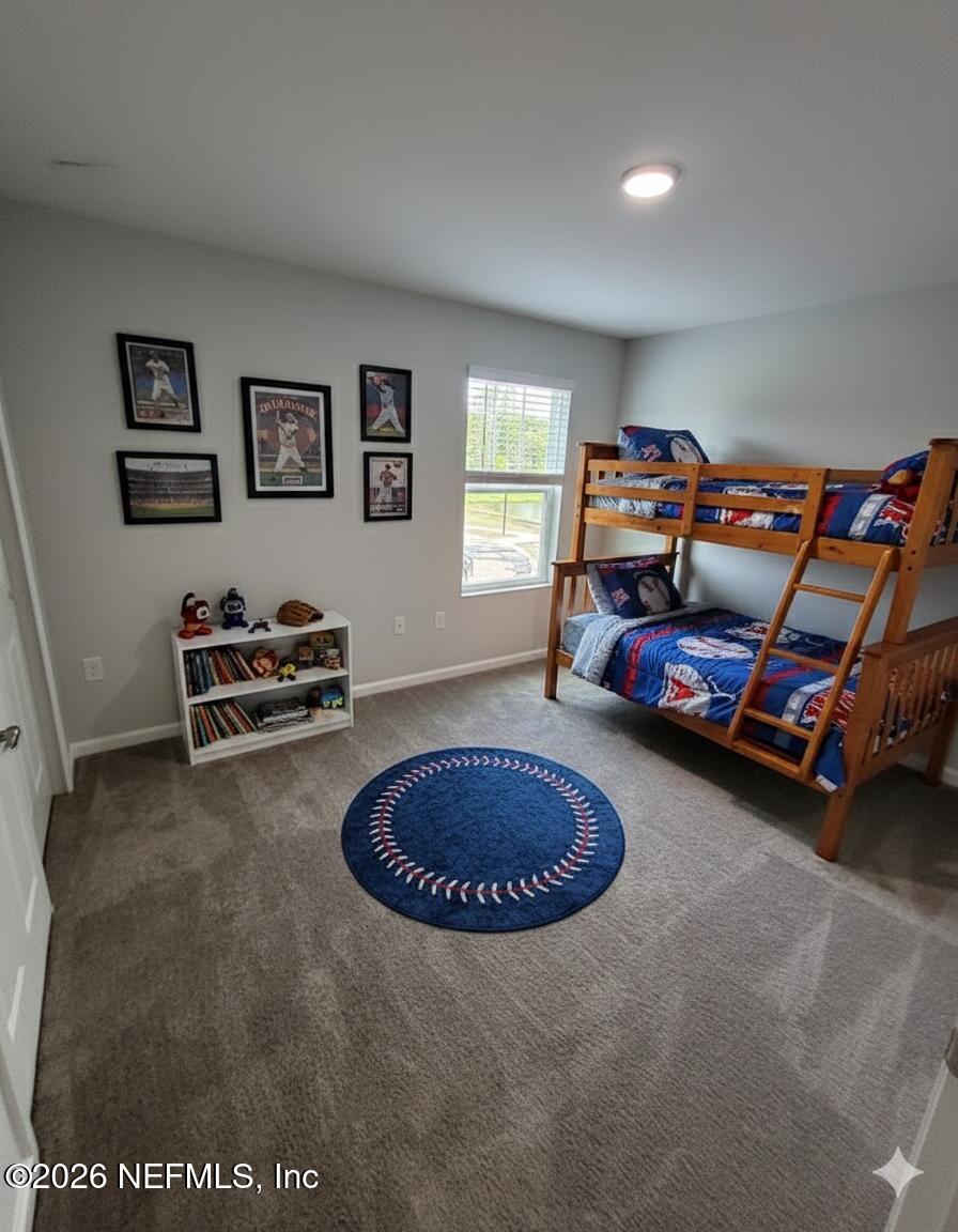 8614 Crystalline Lane Jacksonville, FL 32221 - Photo 13 of 20 a bedroom with furniture and a bed