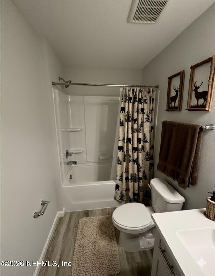8614 Crystalline Lane Jacksonville, FL 32221 - Photo 17 of 20 a bathroom with a toilet a sink and shower