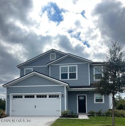 8614 Crystalline Lane Jacksonville, FL 32221 - Photo 20 of 20 a front view of a house with yard and garage