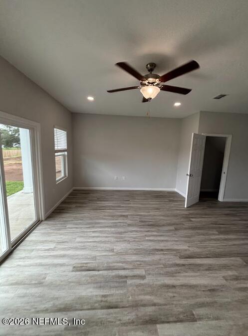 8614 Crystalline Lane Jacksonville, FL 32221 - Photo 5 of 20 wooden floor in an empty room with a window