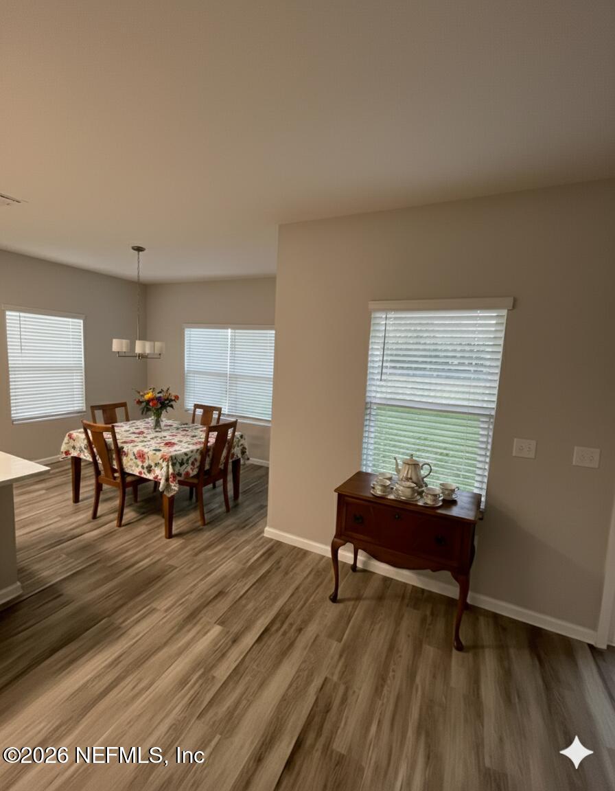 8614 Crystalline Lane Jacksonville, FL 32221 - Photo 6 of 20 a living room with furniture and a large window