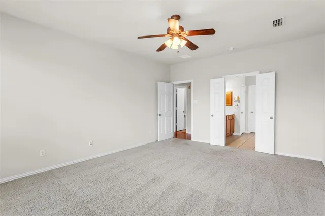 a view of a livingroom with a ceiling fan
