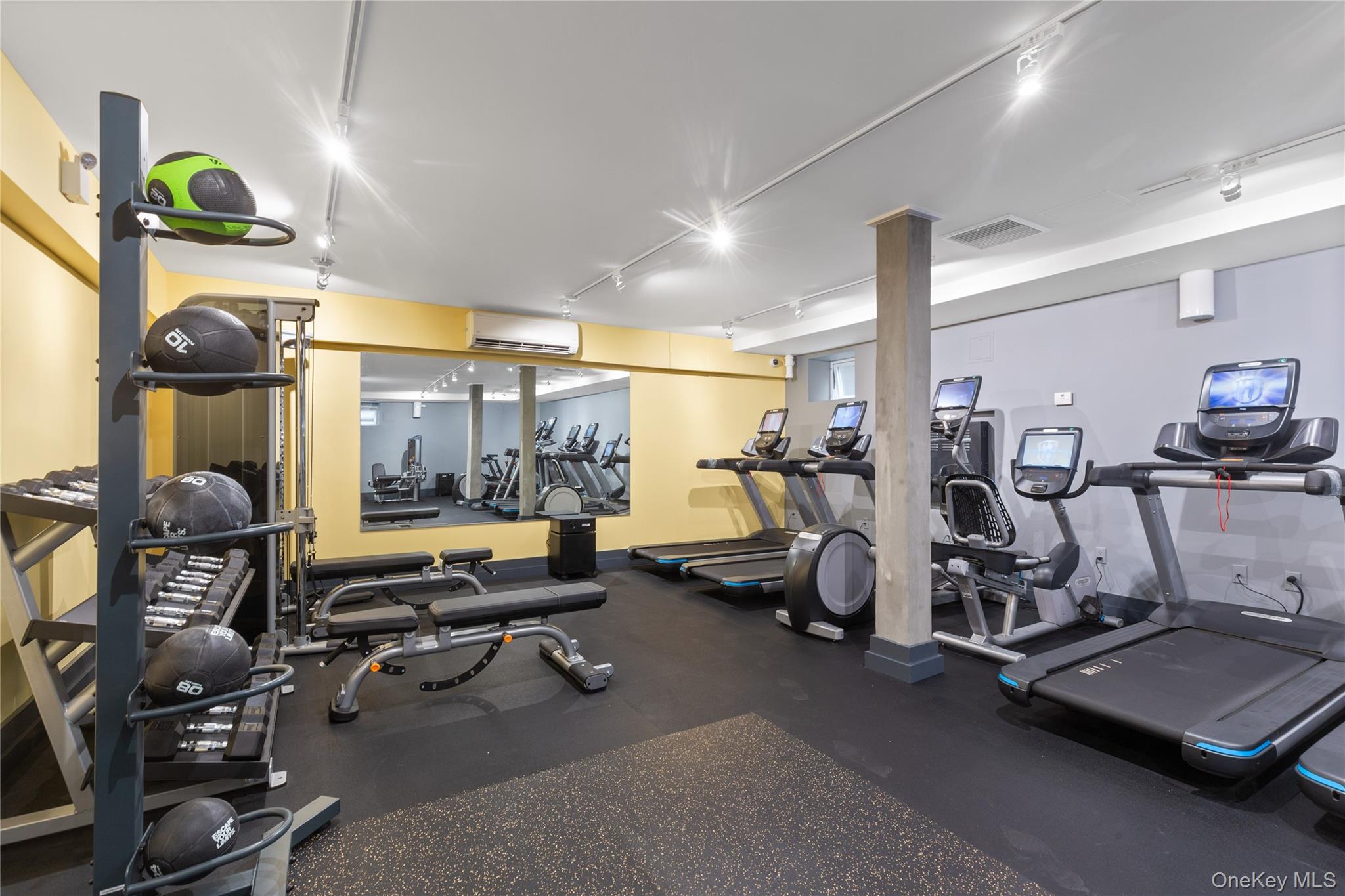 73-12 35th Avenue, Unit D2 Queens, NY 11372 - Photo 11 of 15 a view of a room with gym equipment