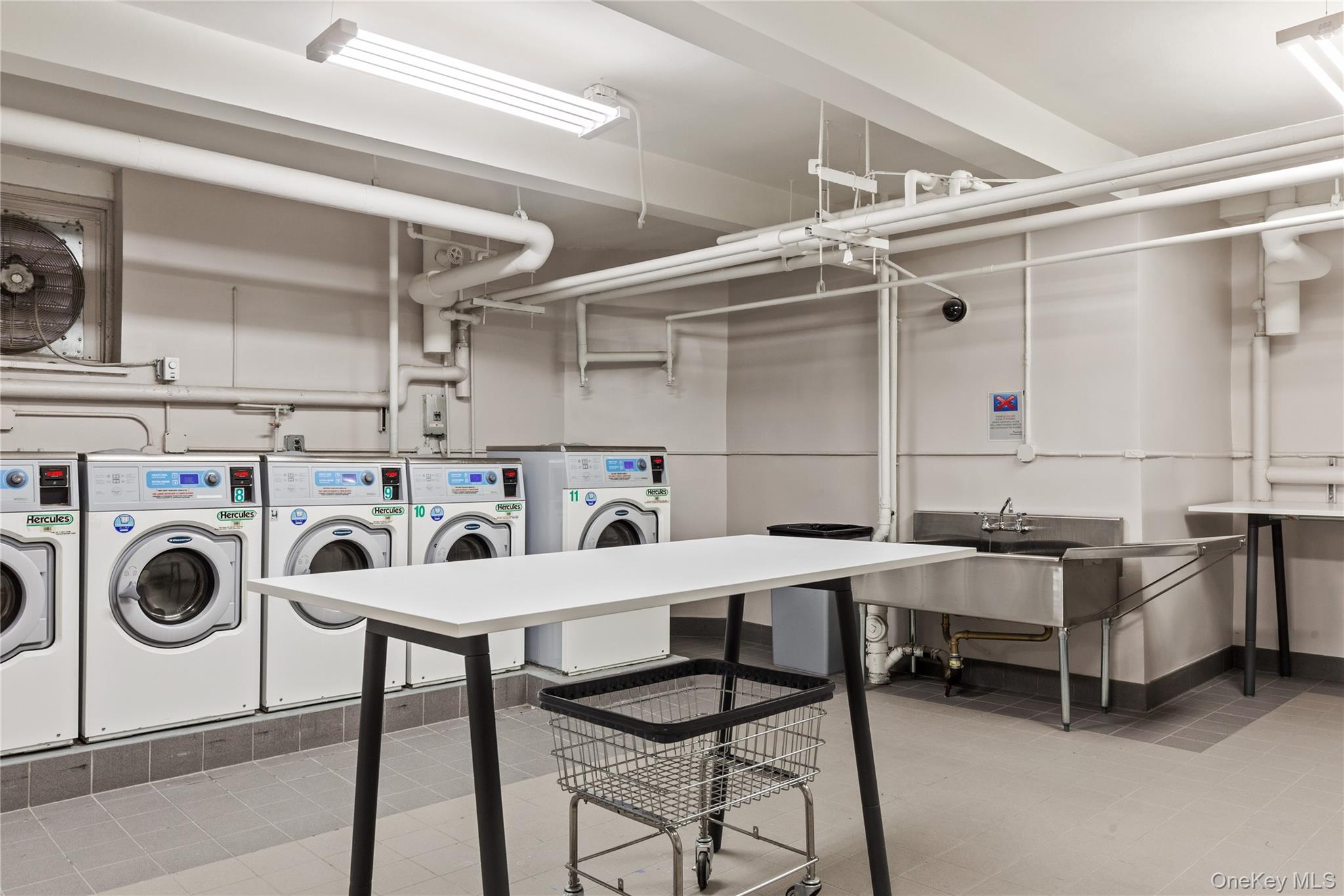 73-12 35th Avenue, Unit D2 Queens, NY 11372 - Photo 12 of 15 a utility room with dryer and washer