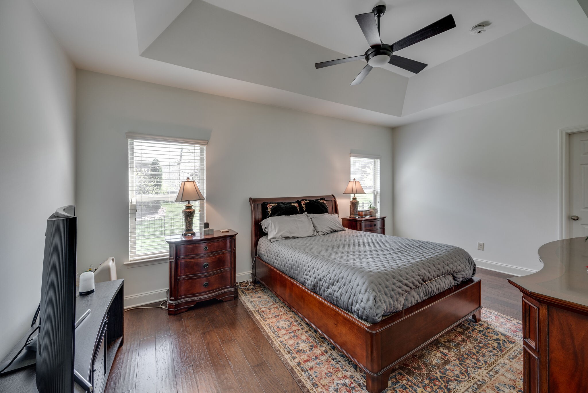 5012 Rizer Point Drive Franklin, TN 37069 - Photo 17 of 38 a bedroom with a bed and a ceiling fan