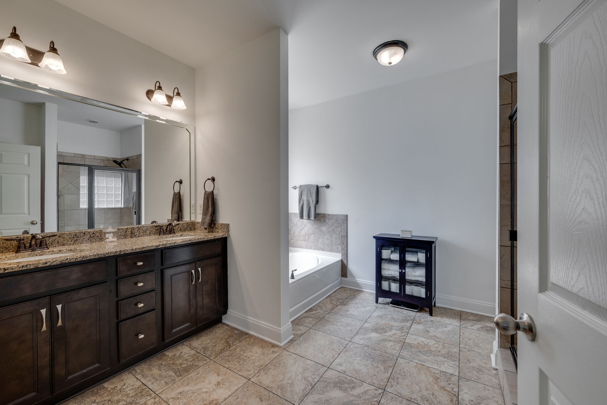 5012 Rizer Point Drive Franklin, TN 37069 - Photo 19 of 38 a spacious bathroom with a double vanity sink a and a mirror