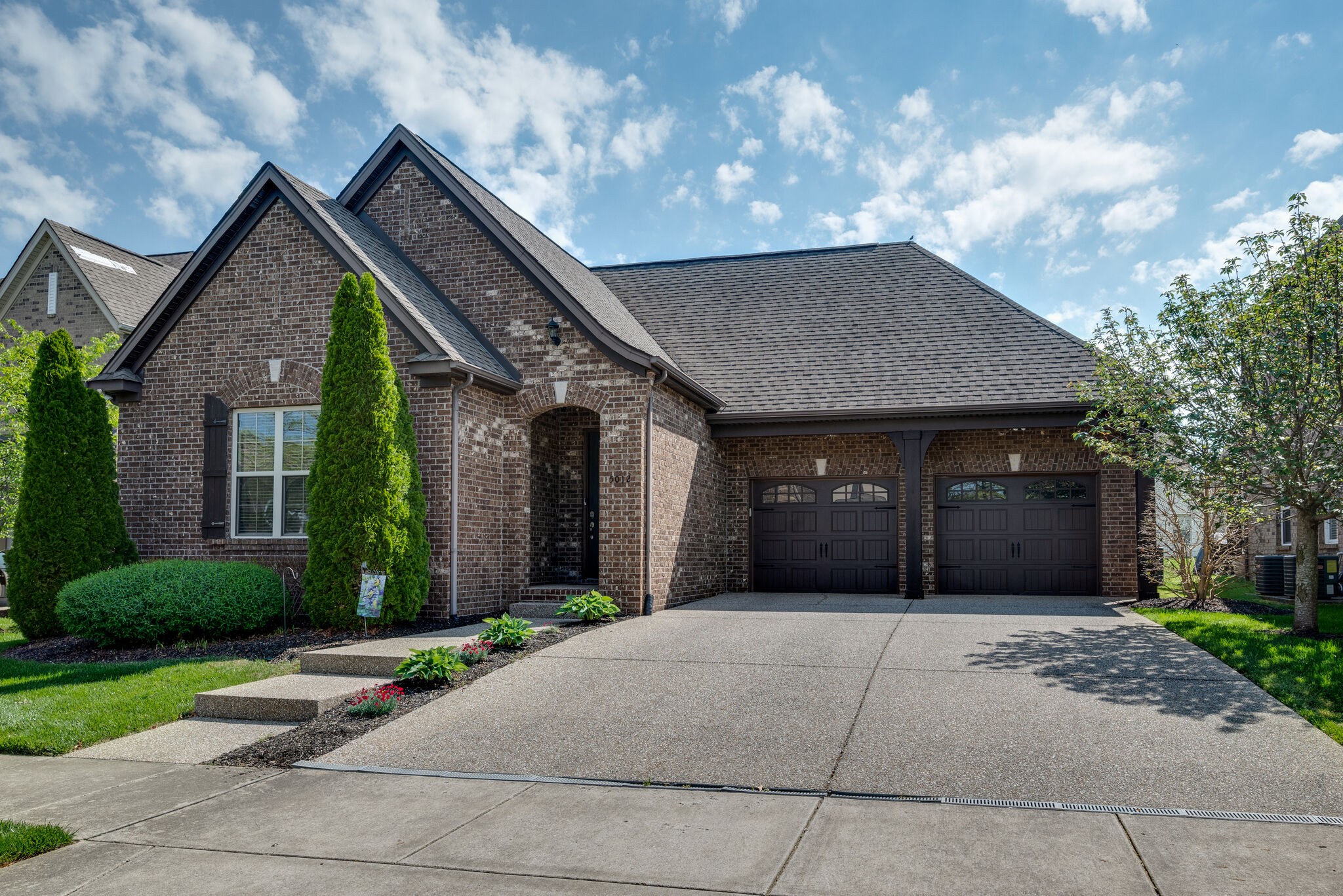 5012 Rizer Point Drive Franklin, TN 37069 - Photo 2 of 38 a front view of a house with garden