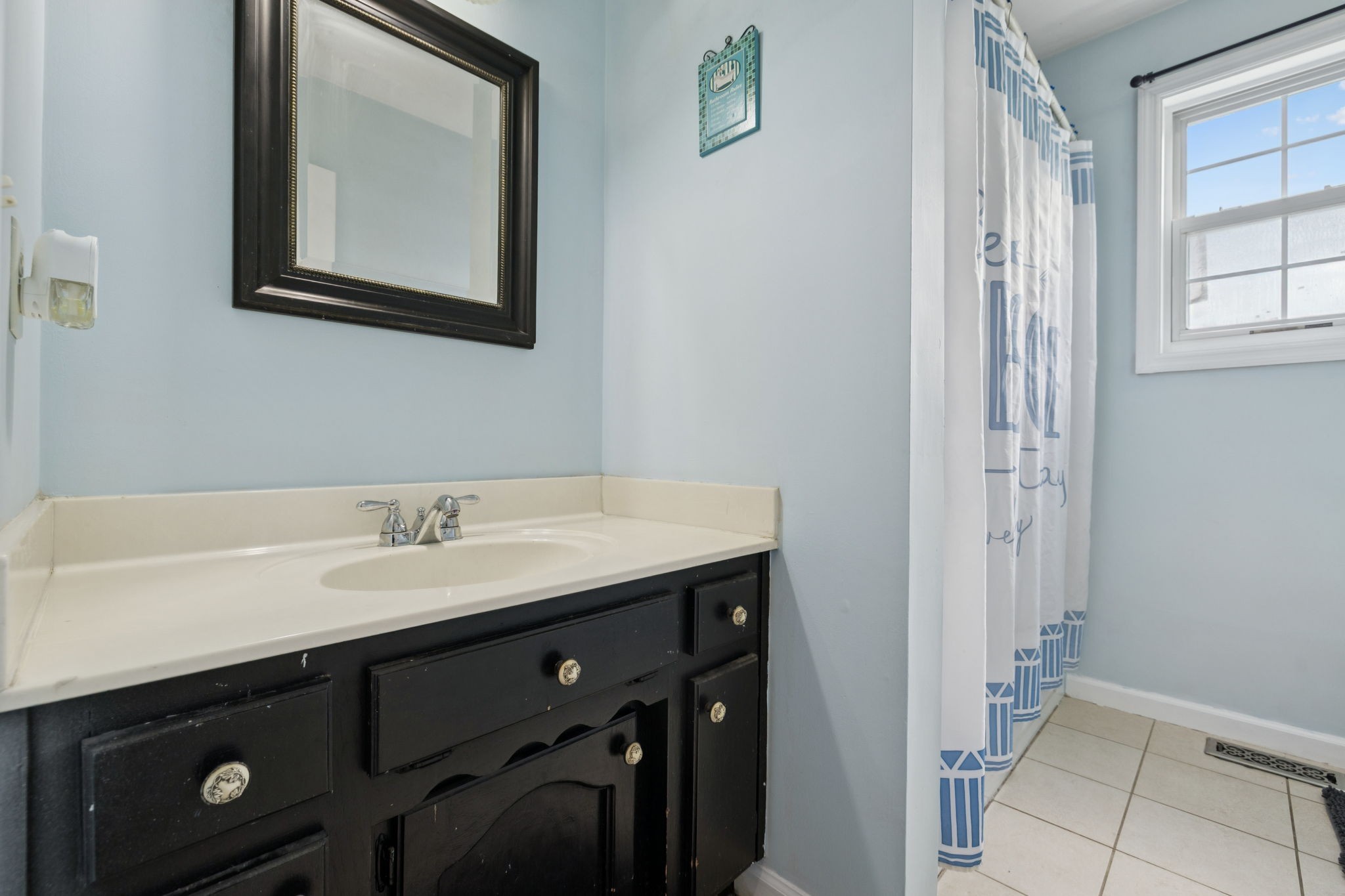 1016 Keystone Drive Pleasant View, TN 37146 - Photo 20 of 33 a bathroom with a sink a vanity and a mirror