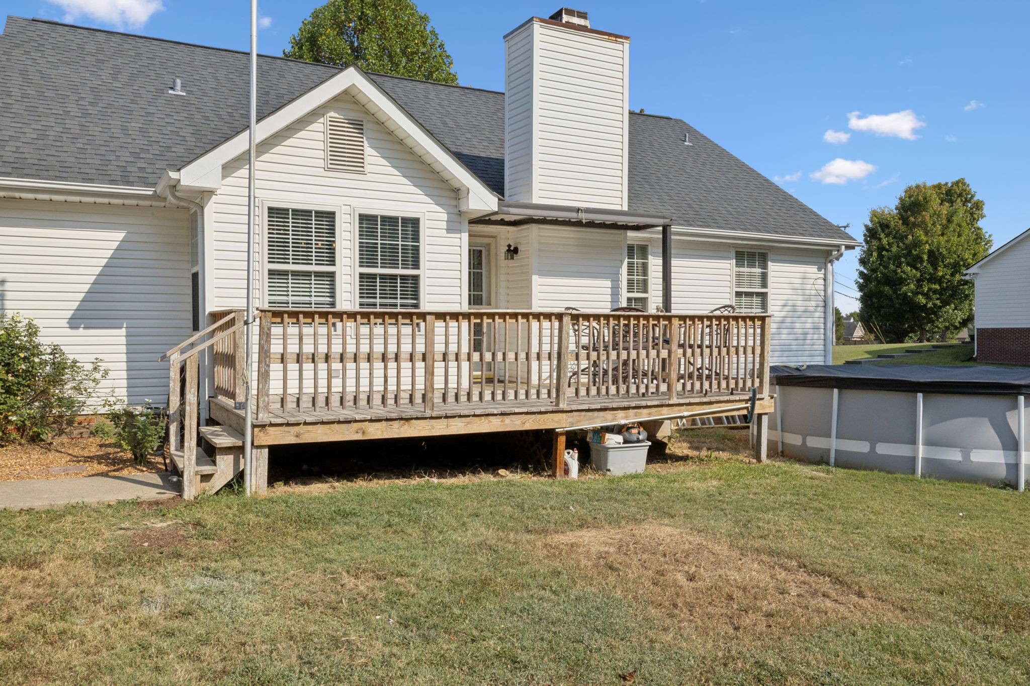 1016 Keystone Drive Pleasant View, TN 37146 - Photo 22 of 33 a view of a house with a yard and deck area