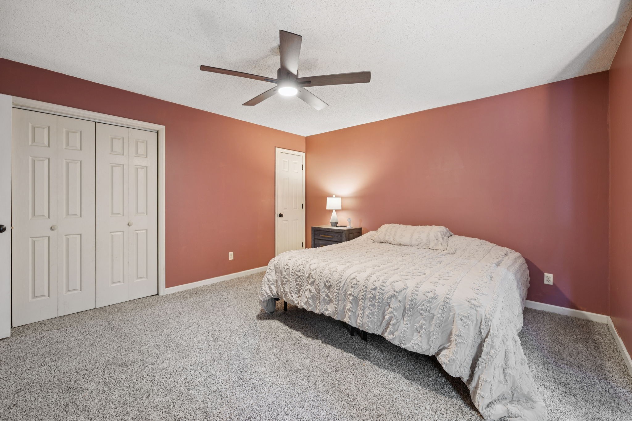 1016 Keystone Drive Pleasant View, TN 37146 - Photo 8 of 33 a bedroom with a bed and a ceiling fan