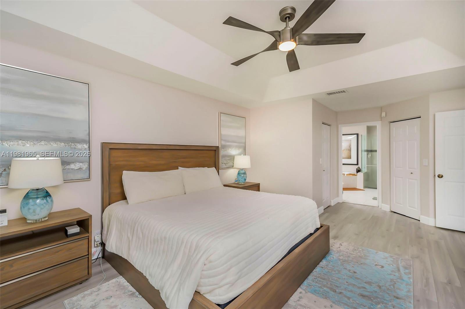 11030 Harbour Springs Circle Boca Raton, FL 33428 - Photo 12 of 39 a bedroom with a bed and window