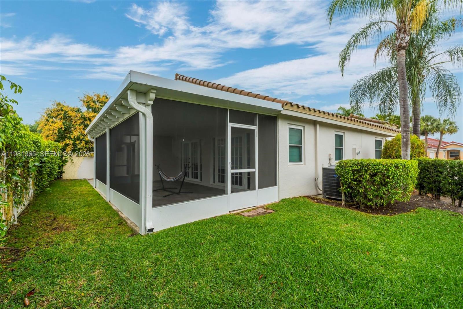 11030 Harbour Springs Circle Boca Raton, FL 33428 - Photo 18 of 39 a view of an house with backyard space and garden
