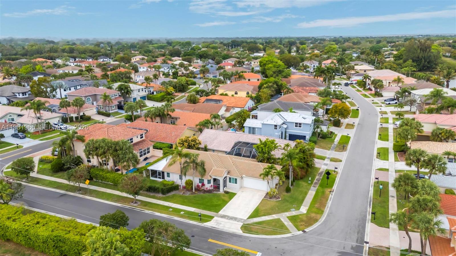 11030 Harbour Springs Circle Boca Raton, FL 33428 - Photo 29 of 39 an aerial view of residential houses with outdoor space and trees