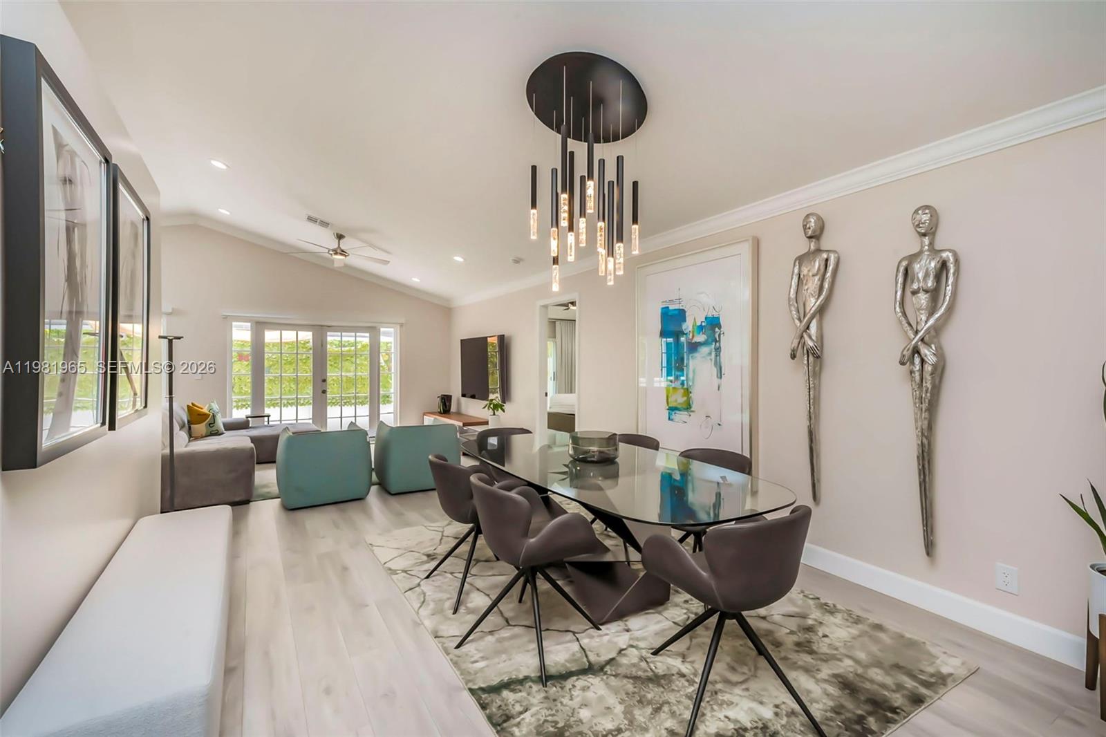 11030 Harbour Springs Circle Boca Raton, FL 33428 - Photo 7 of 39 a living room with furniture and a large window
