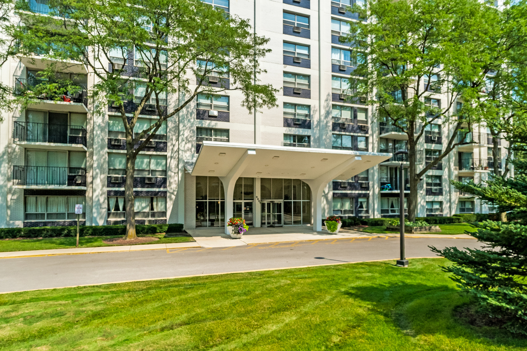 9001 West Golf Road, Unit 6B Des Plaines, IL 60016 - Photo 1 of 4 front view of a building with a yard