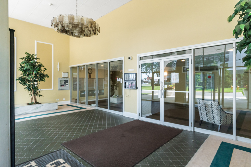 9001 West Golf Road, Unit 6B Des Plaines, IL 60016 - Photo 2 of 4 a living room with a large window