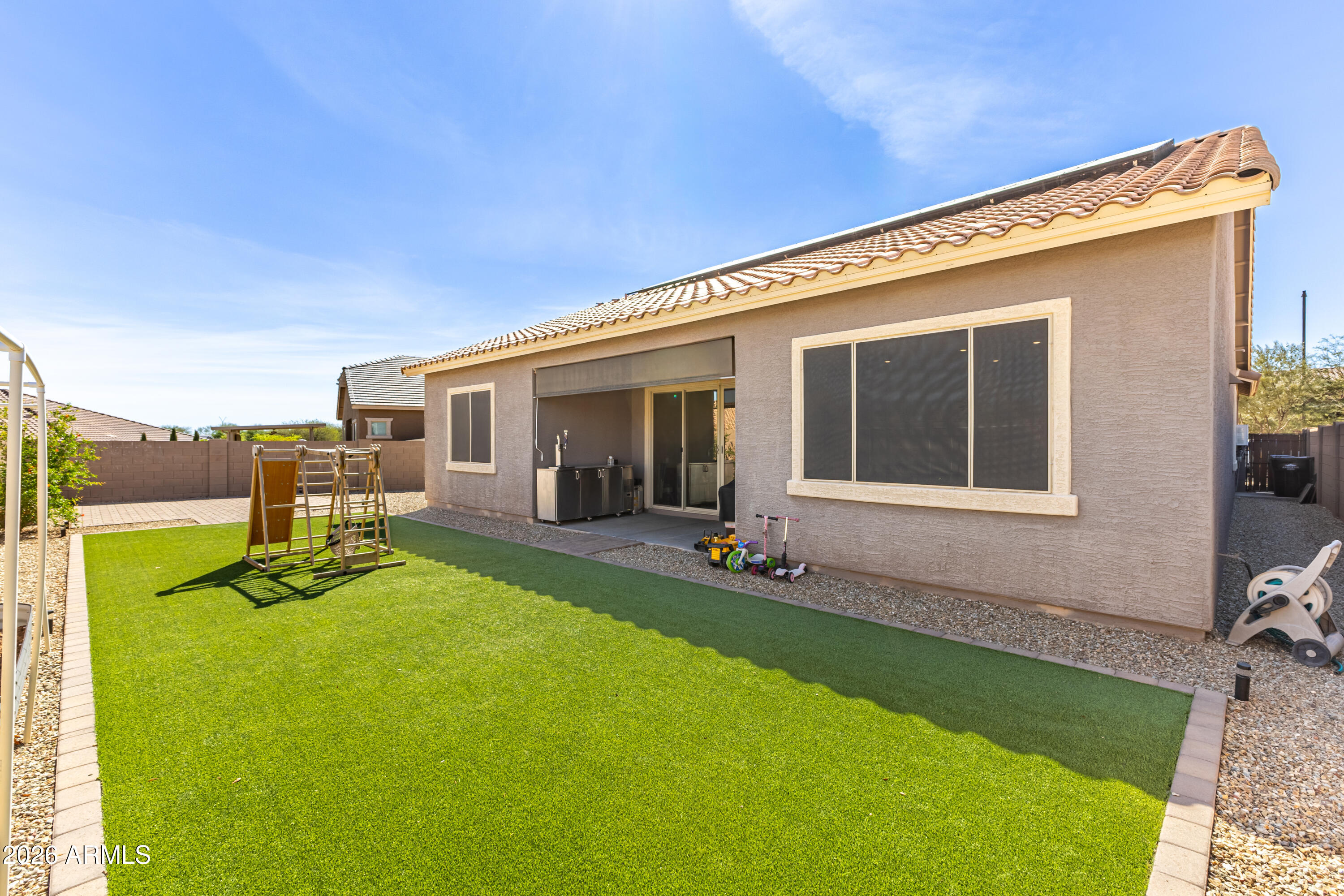23929 North 166th Lane Surprise, AZ 85387 - Photo 22 of 23 a swimming pool with outdoor seating and yard