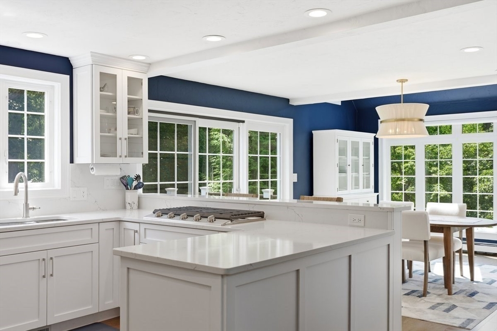 47 Old Coach Road Cohasset, MA 02025 - Photo 14 of 40 a view of a kitchen counter top space with a sink and cabinets