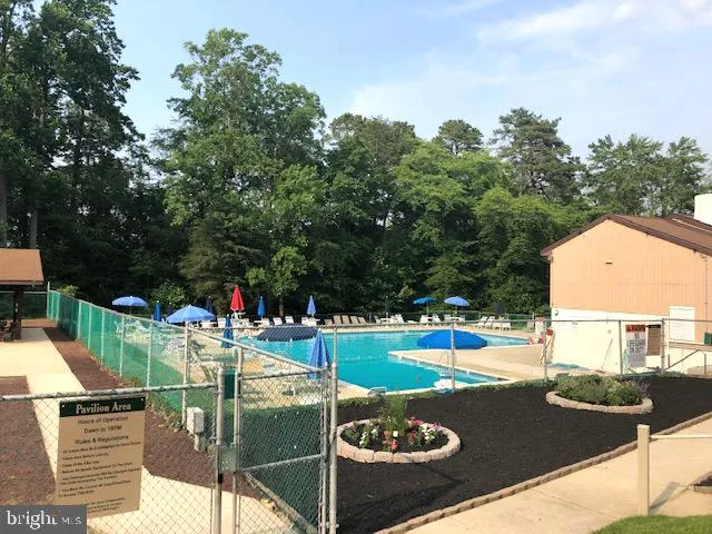 a view of a swimming pool with a patio