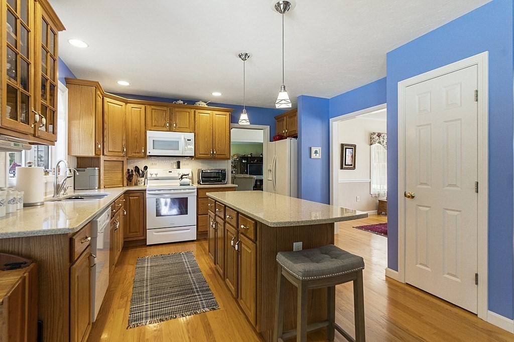 71 Easter Brook Road Lunenburg, MA 01462 - Photo 12 of 33 a kitchen with stainless steel appliances granite countertop a sink stove and refrigerator