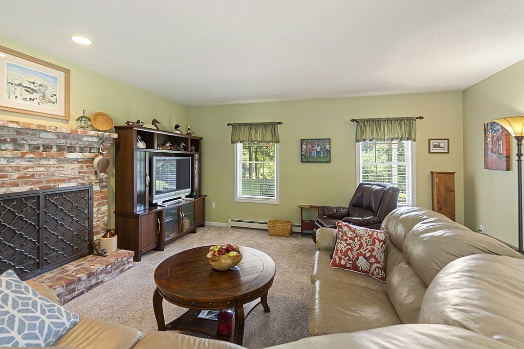 71 Easter Brook Road Lunenburg, MA 01462 - Photo 15 of 33 a living room with furniture and a flat screen tv