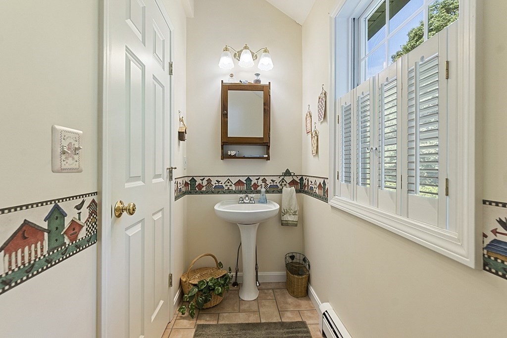 71 Easter Brook Road Lunenburg, MA 01462 - Photo 18 of 33 a bathroom with a sink a mirror and a window