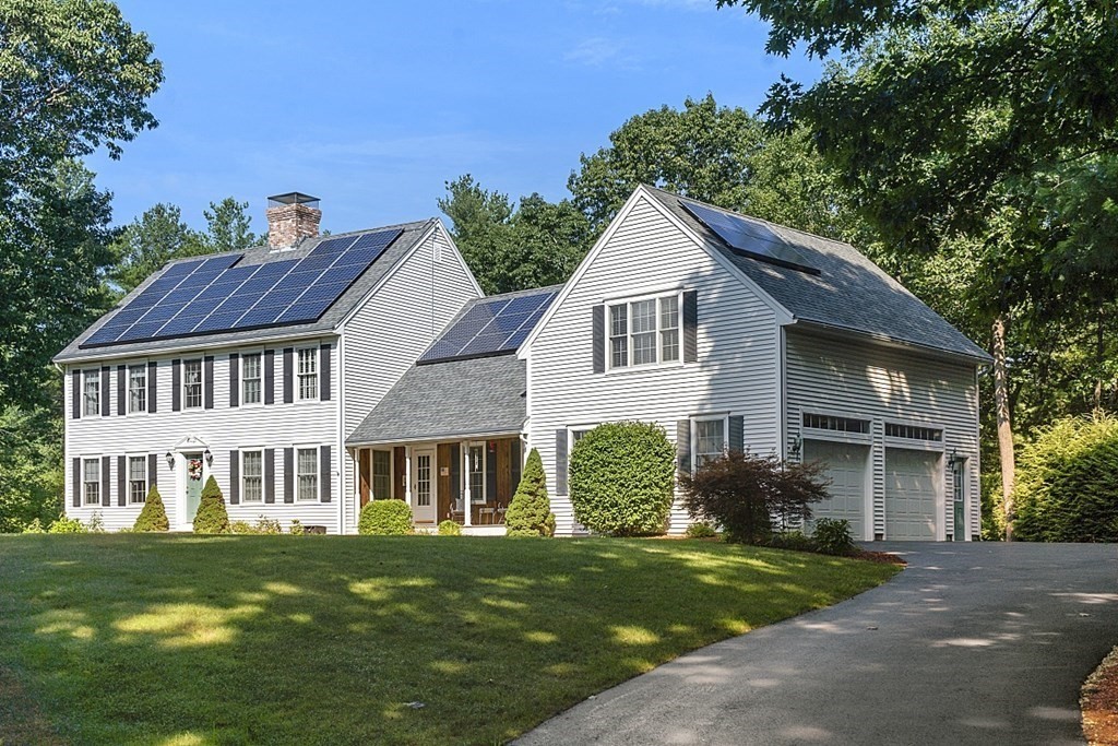 71 Easter Brook Road Lunenburg, MA 01462 - Photo 2 of 33 a front view of a house with a garden