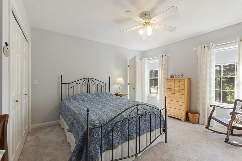 71 Easter Brook Road Lunenburg, MA 01462 - Photo 22 of 33 a bedroom with a bed a table and chair