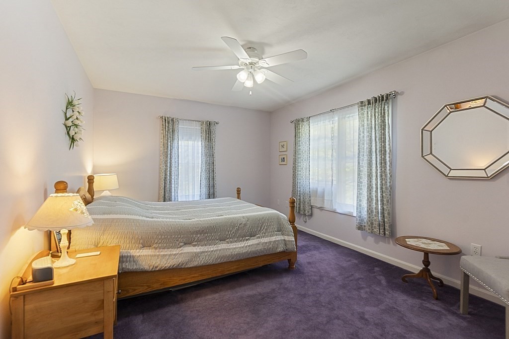 71 Easter Brook Road Lunenburg, MA 01462 - Photo 23 of 33 a bedroom with a bed and dresser with mirror