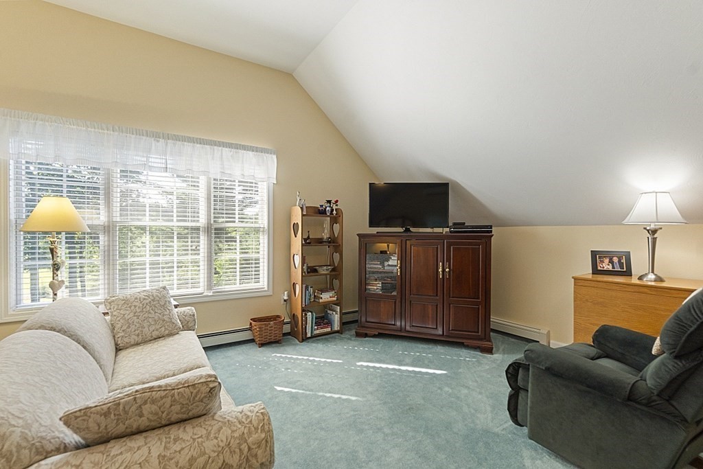 71 Easter Brook Road Lunenburg, MA 01462 - Photo 25 of 33 a living room with furniture and a flat screen tv