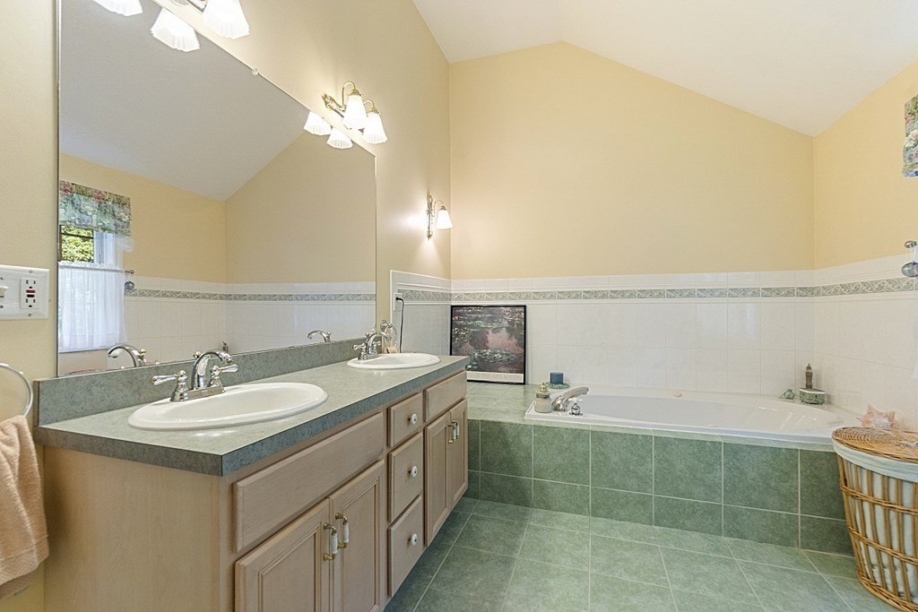 71 Easter Brook Road Lunenburg, MA 01462 - Photo 28 of 33 a bathroom with a sink vanity and a mirror