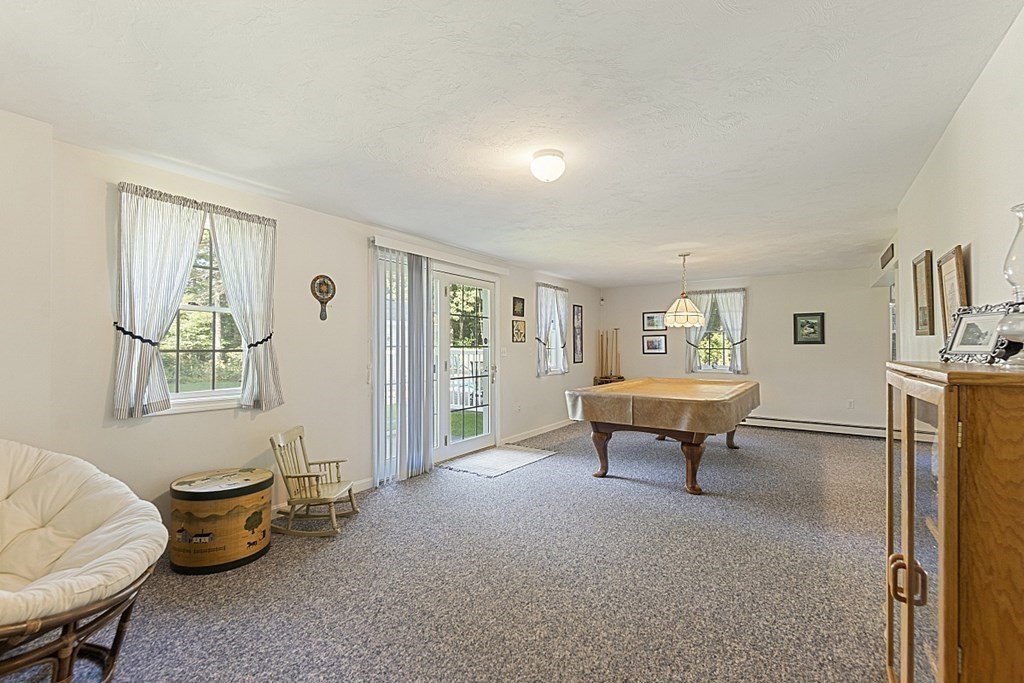 71 Easter Brook Road Lunenburg, MA 01462 - Photo 32 of 33 a living room with furniture and a window