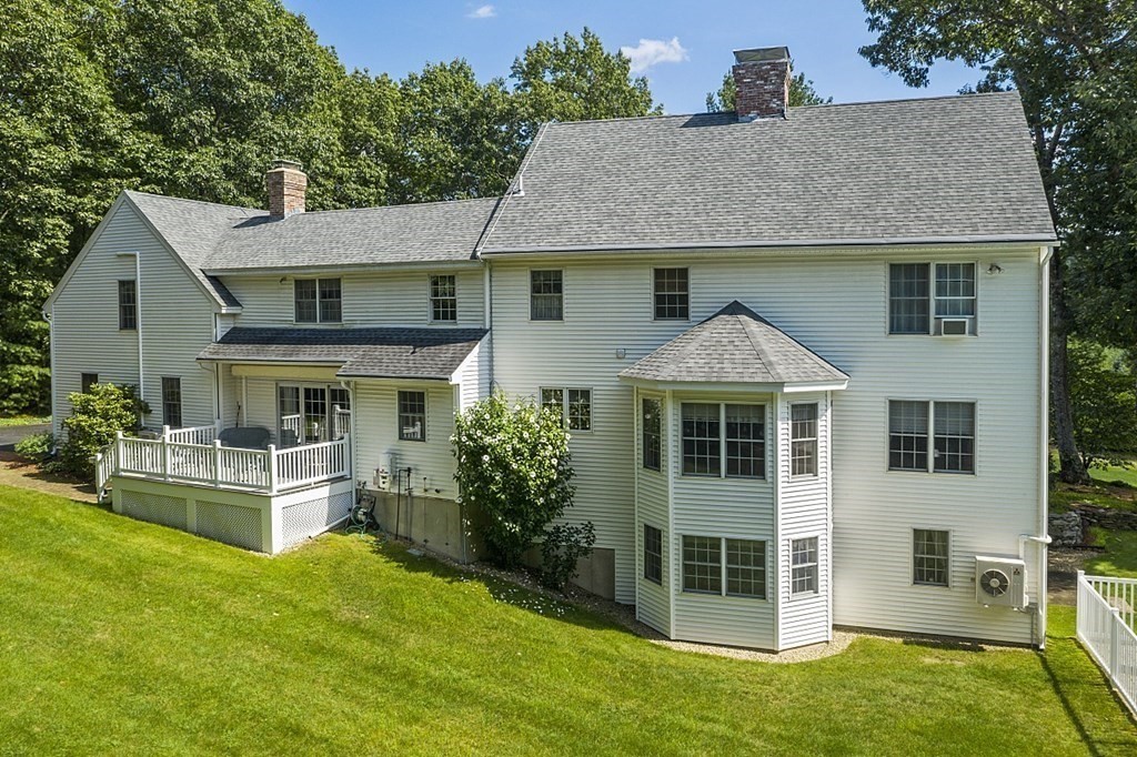 71 Easter Brook Road Lunenburg, MA 01462 - Photo 5 of 33 a front view of a house with a yard