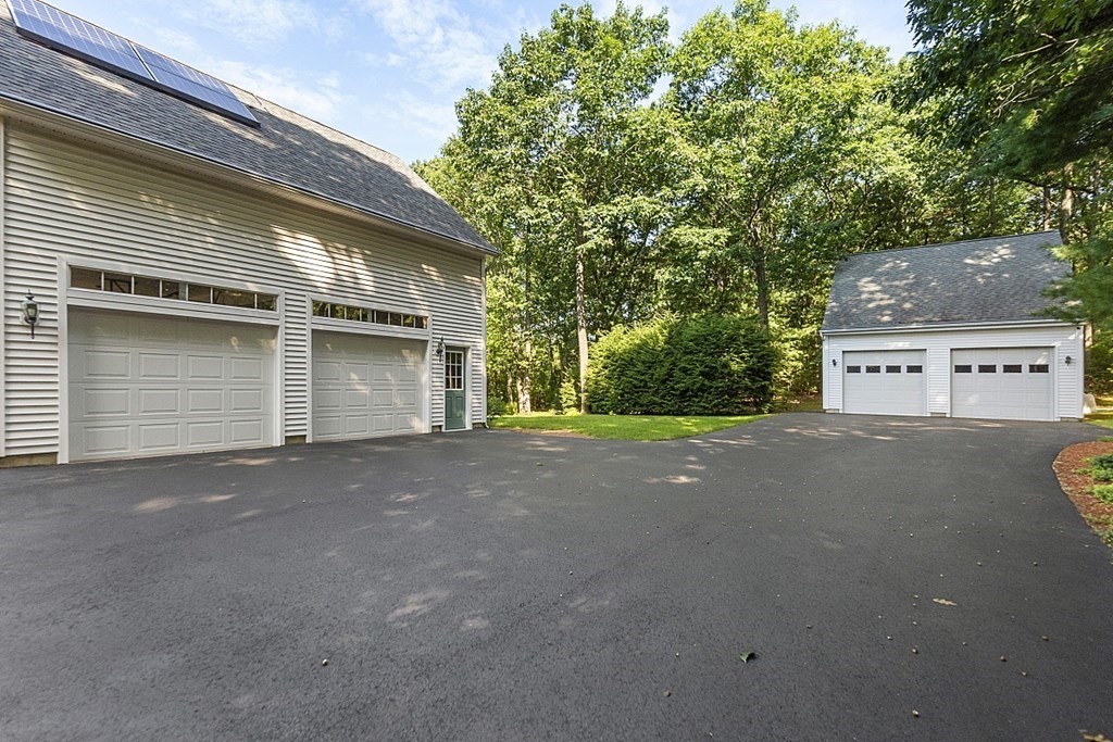 71 Easter Brook Road Lunenburg, MA 01462 - Photo 8 of 33 a view of a house with a garage
