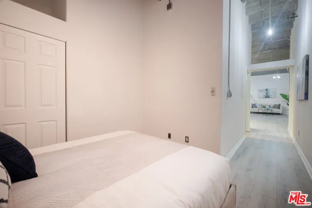 a bedroom with a bed and a view of bathroom