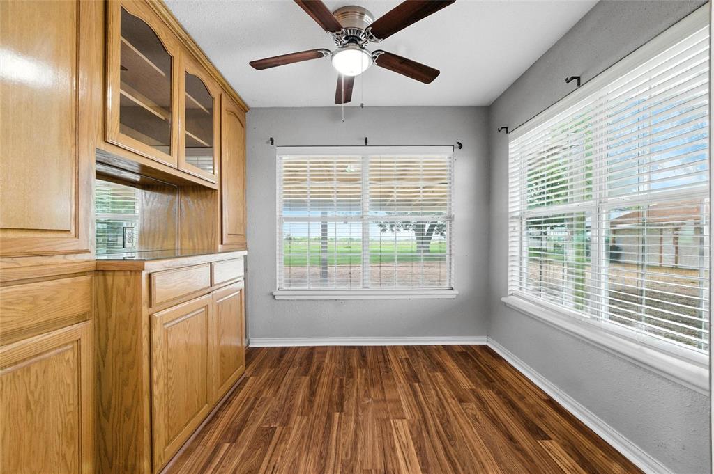 358 Wright Road Waxahachie, TX 75167 - Photo 24 of 38 a view of an empty room with a window and wooden floor