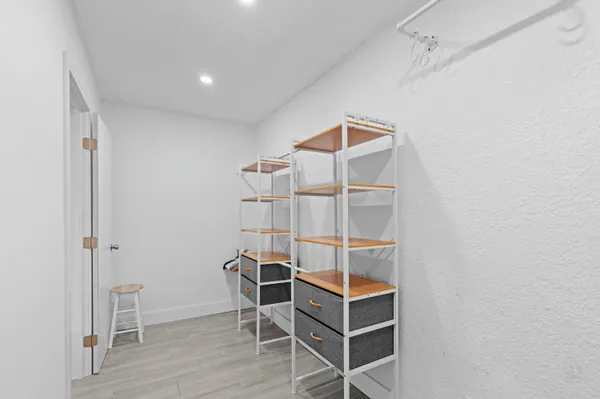 a room with wooden cabinets and table