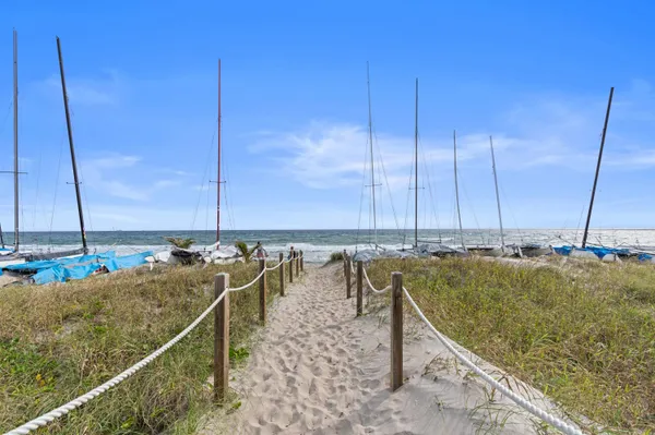 a view of a lake with boats next to a bridge