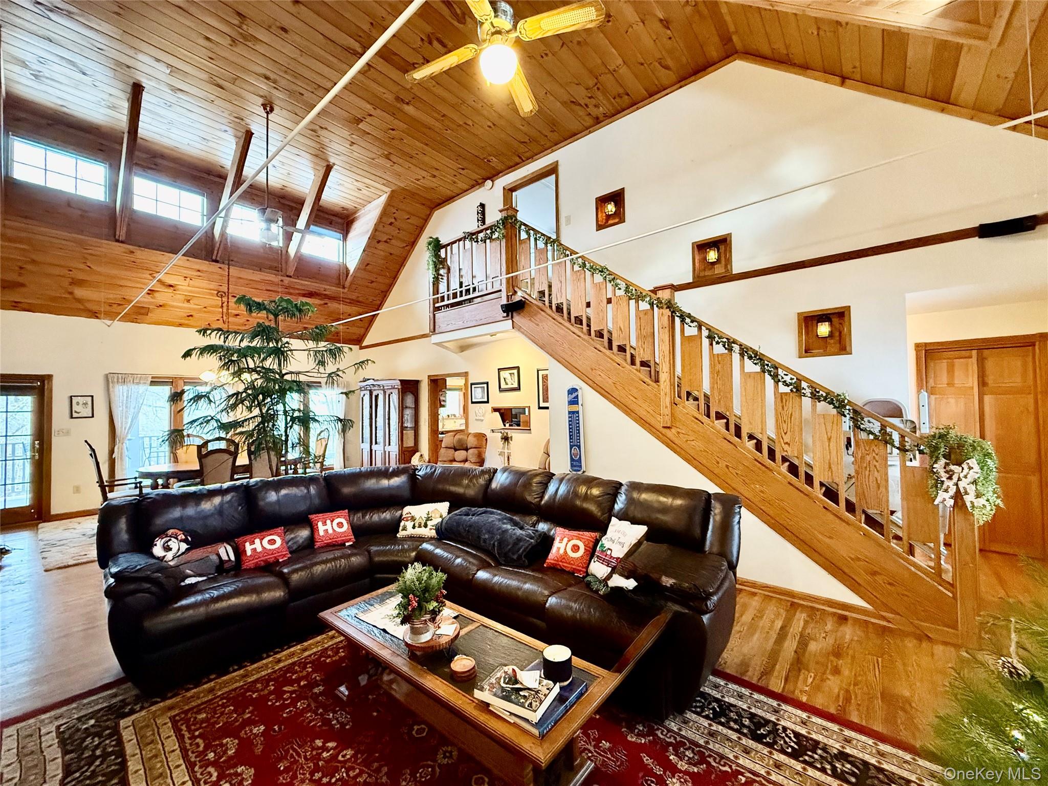 912-918 Hollow Road Salt Point, NY 12578 - Photo 11 of 38 Living room with a high wood ceiling, a ceiling fan, and wood finished floors
