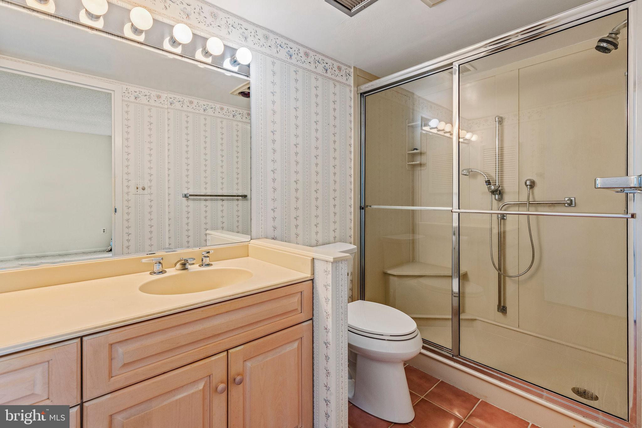 205 East Joppa Road, Unit 1606 Towson, MD 21286 - Photo 17 of 33 a bathroom with a sink a toilet and shower