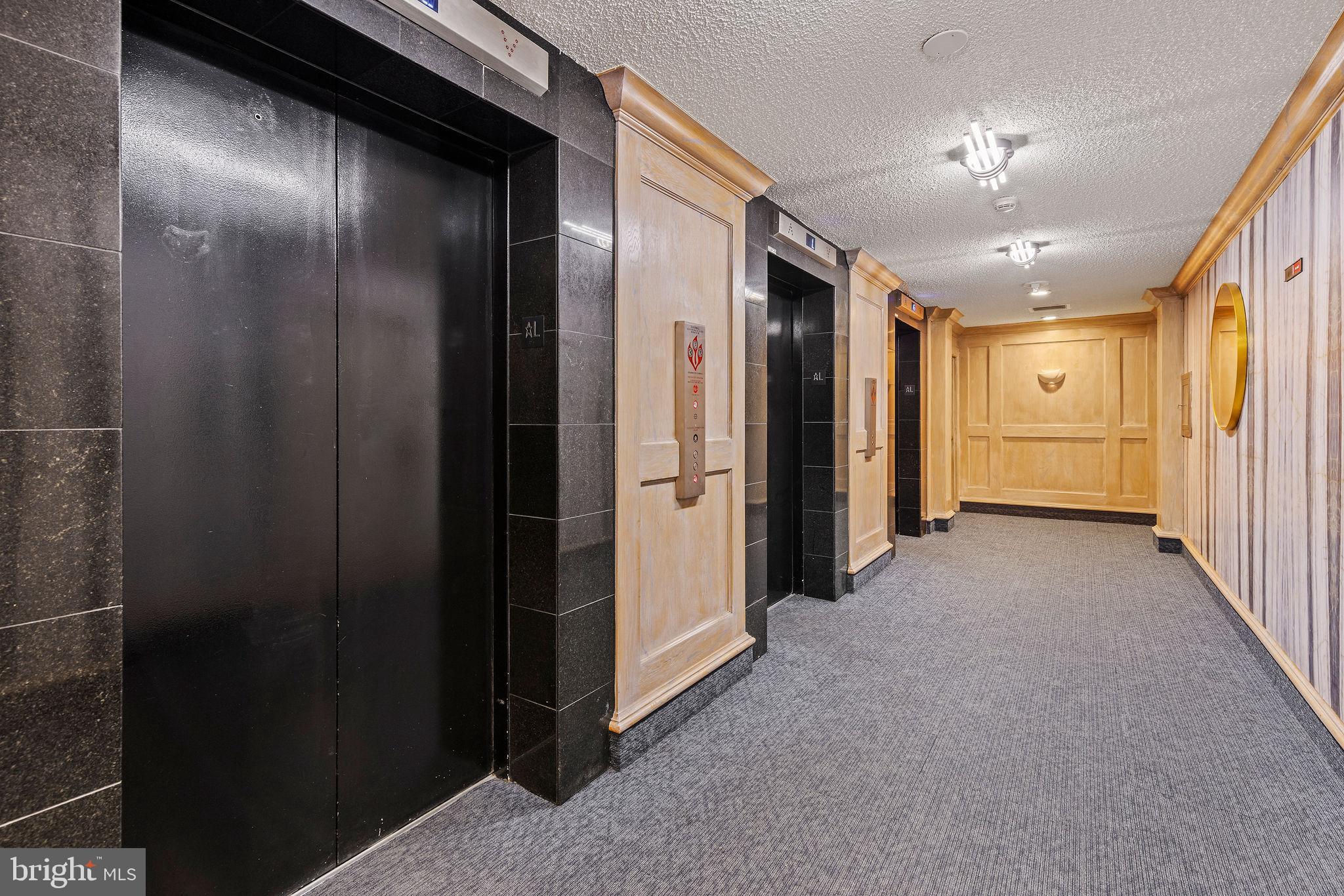 205 East Joppa Road, Unit 1606 Towson, MD 21286 - Photo 26 of 33 a view of a hallway with wooden shelves