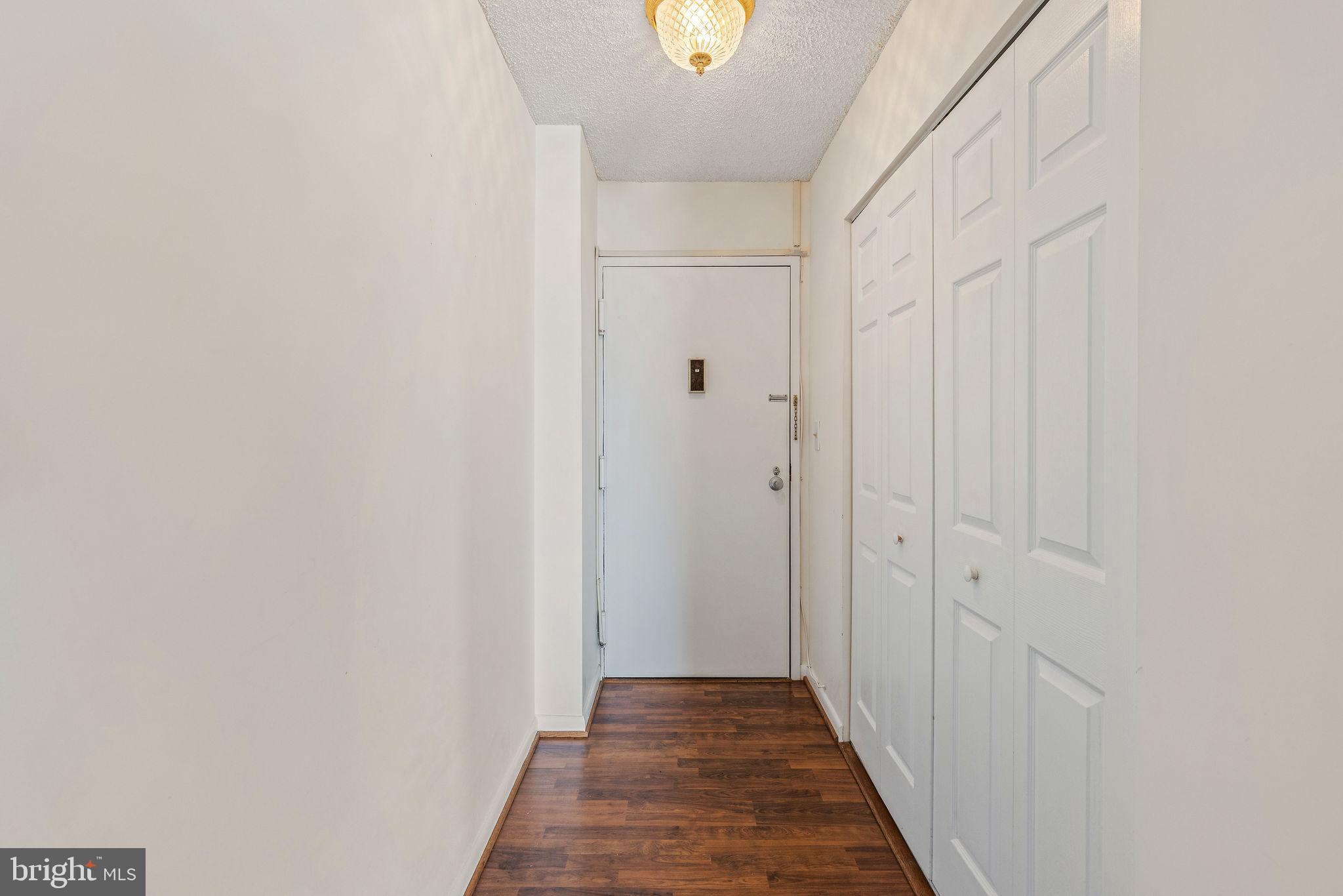 205 East Joppa Road, Unit 1606 Towson, MD 21286 - Photo 4 of 33 a view of a hallway with wooden floor