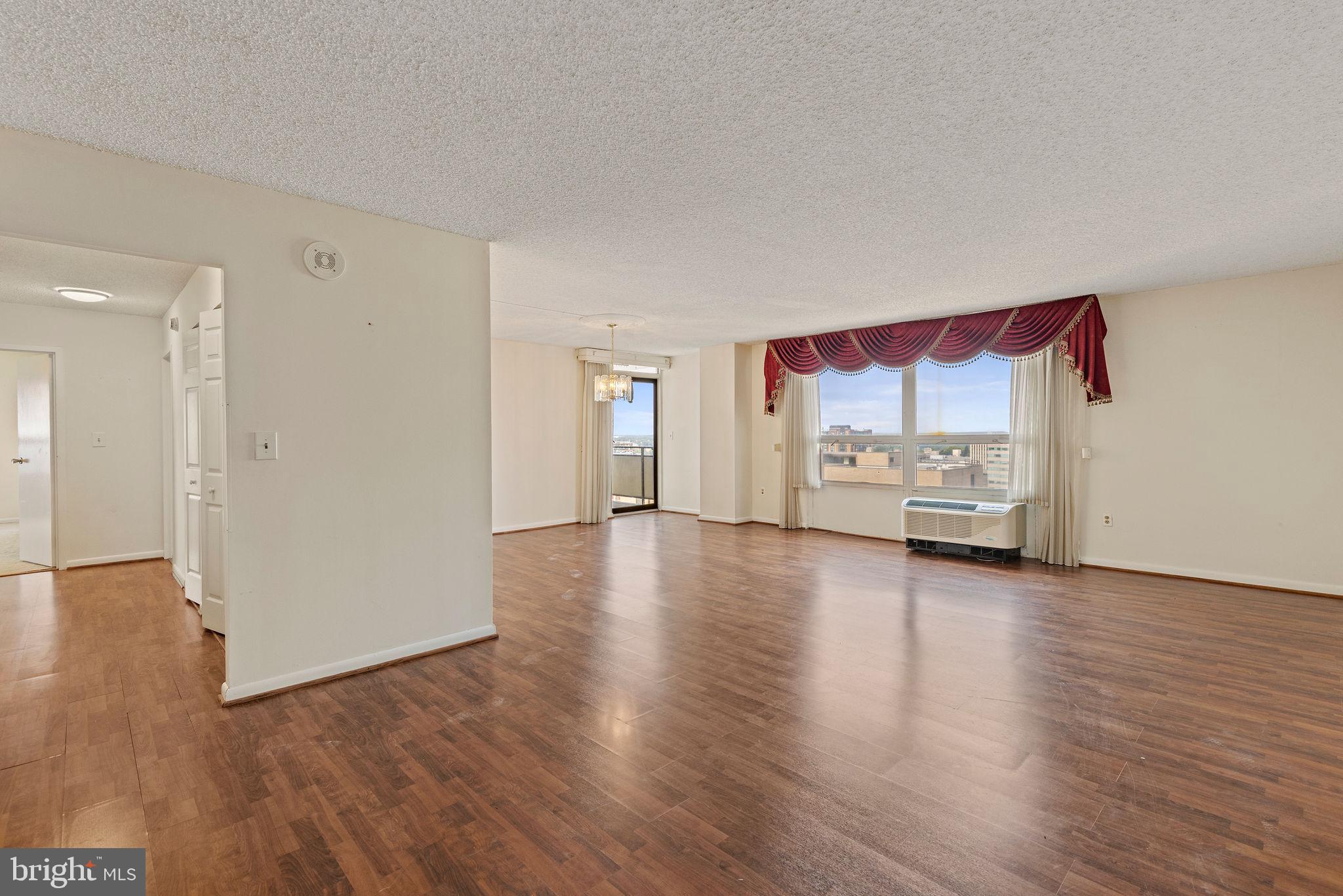 205 East Joppa Road, Unit 1606 Towson, MD 21286 - Photo 5 of 33 a view of a kitchen with furniture and wooden floor