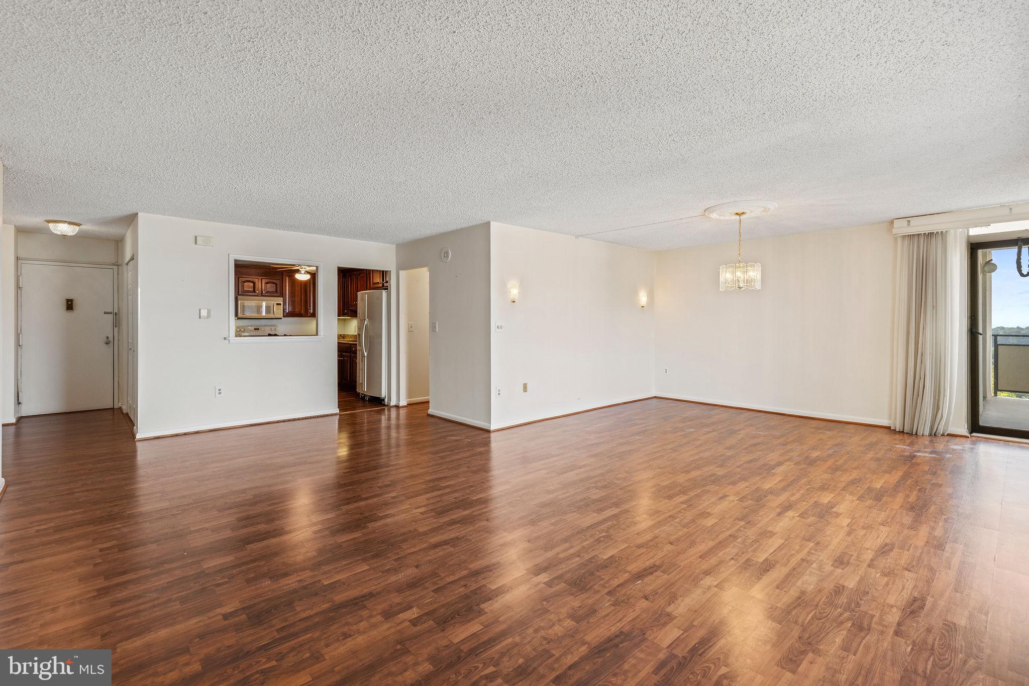 205 East Joppa Road, Unit 1606 Towson, MD 21286 - Photo 9 of 33 a view of empty room with wooden floor