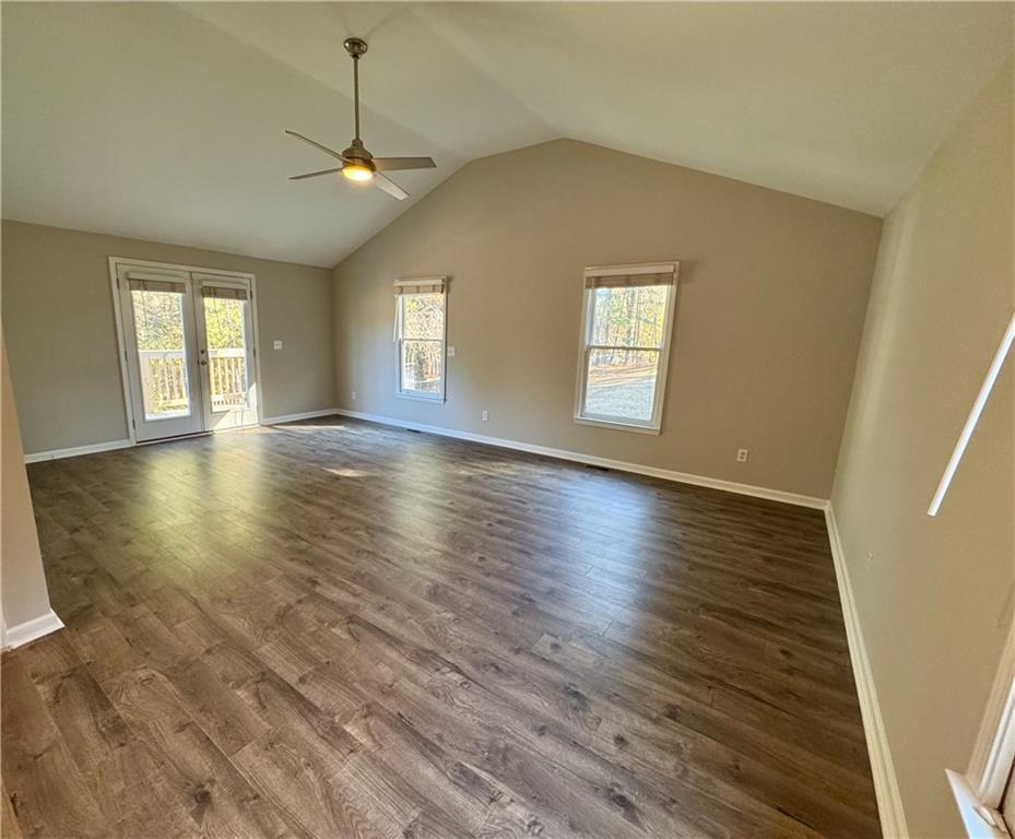 30 Shallowford Road Northeast Kennesaw, GA 30144 - Photo 16 of 41 an empty room with wooden floor and windows