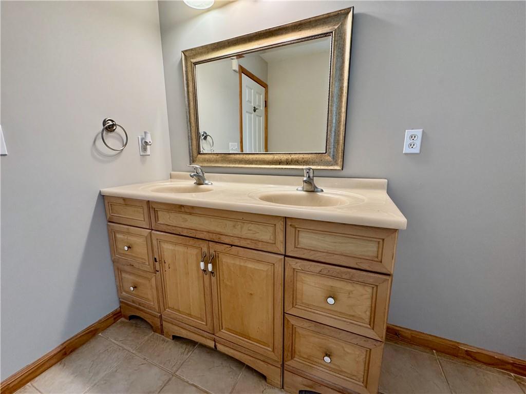 30 Shallowford Road Northeast Kennesaw, GA 30144 - Photo 20 of 41 a bathroom with a sink vanity and mirror