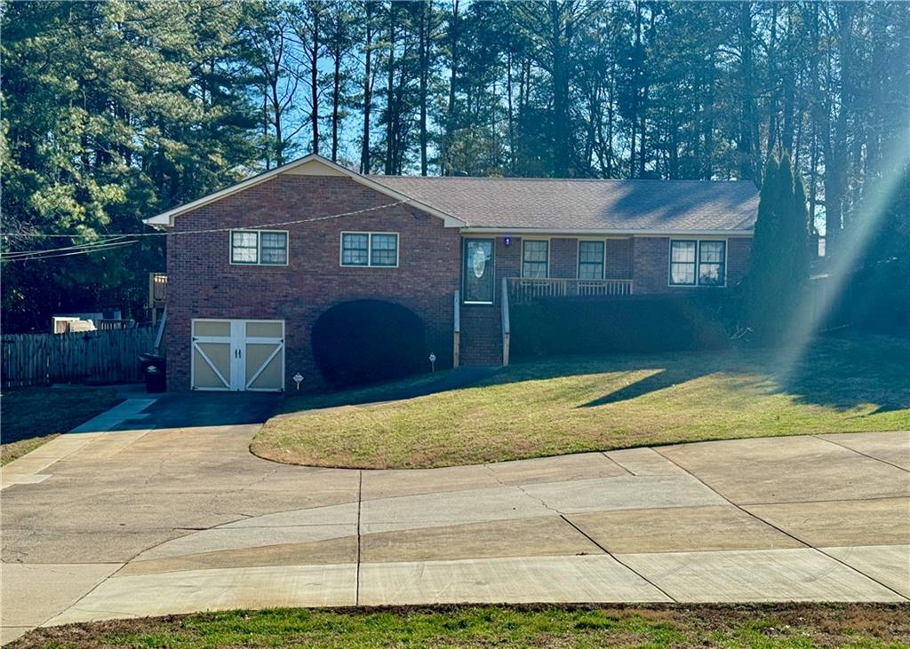 30 Shallowford Road Northeast Kennesaw, GA 30144 - Photo 2 of 41 a view of a brick house next to a yard