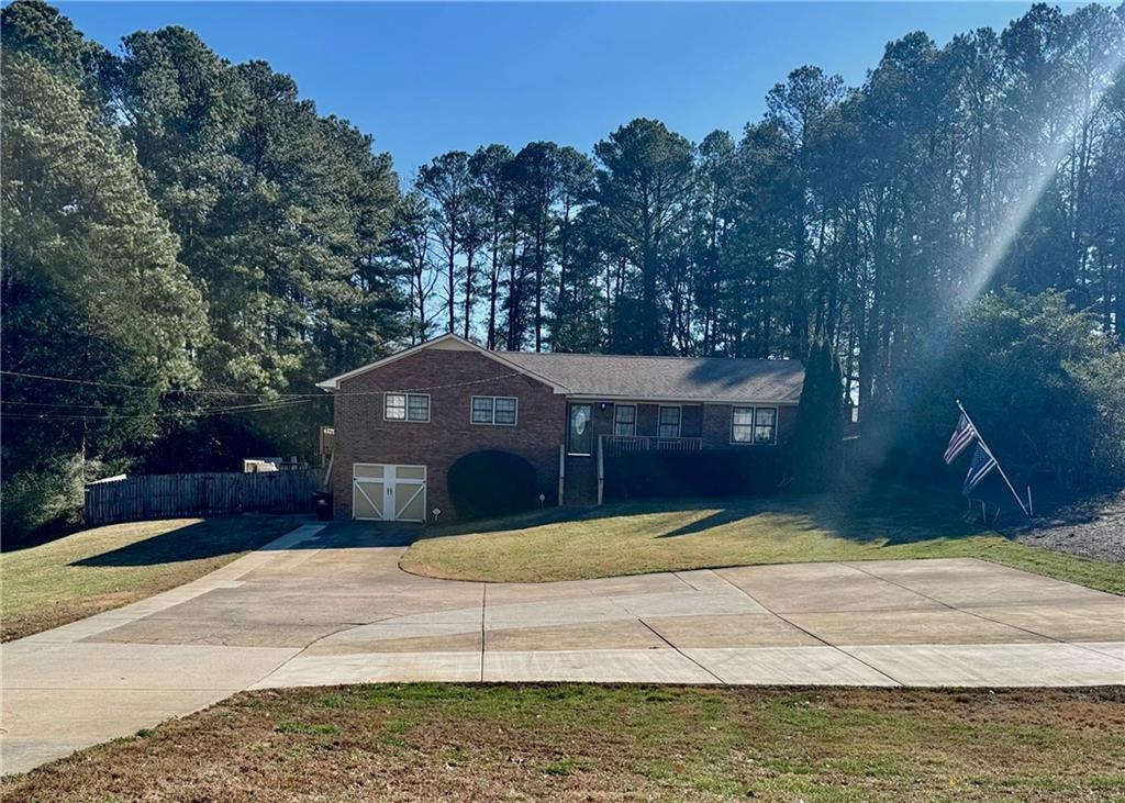 30 Shallowford Road Northeast Kennesaw, GA 30144 - Photo 25 of 41 a view of a house with a yard